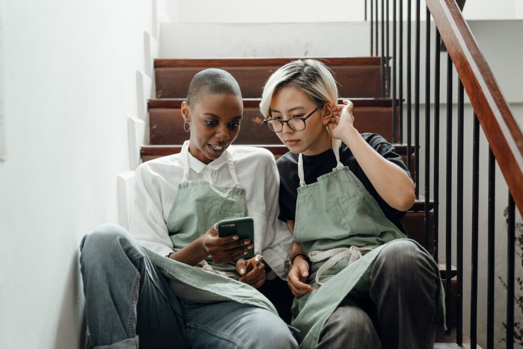 2 women working on tablet