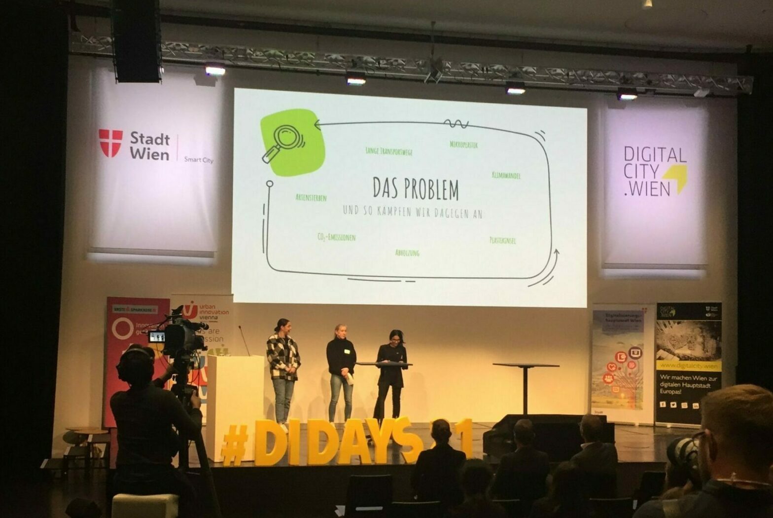 3 girls presenting their hackathon app ion stage